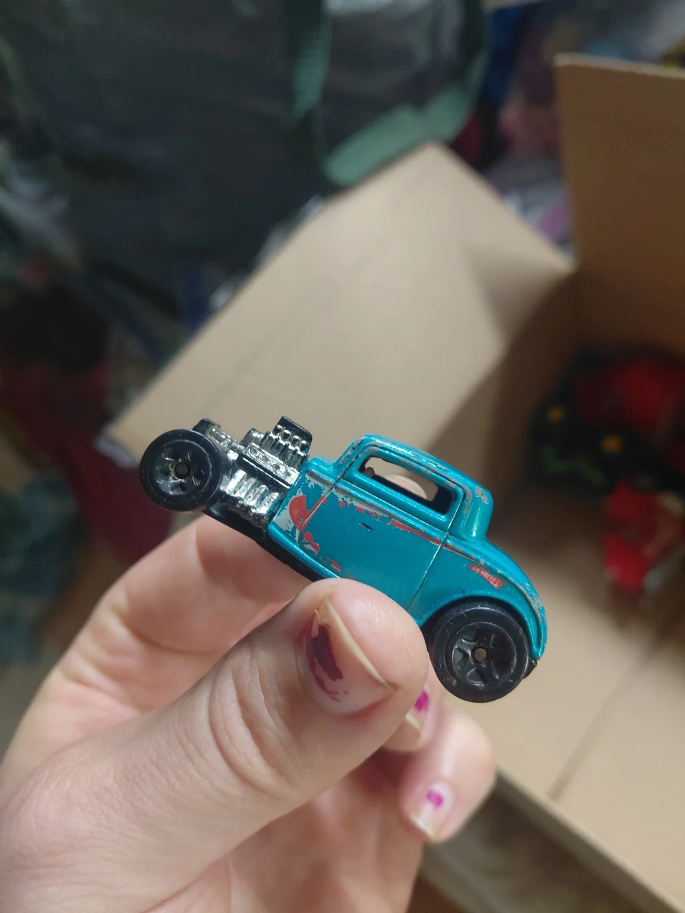 vintage 1997 Hot Wheels '32 Ford die-cast toy car in a light blue color.